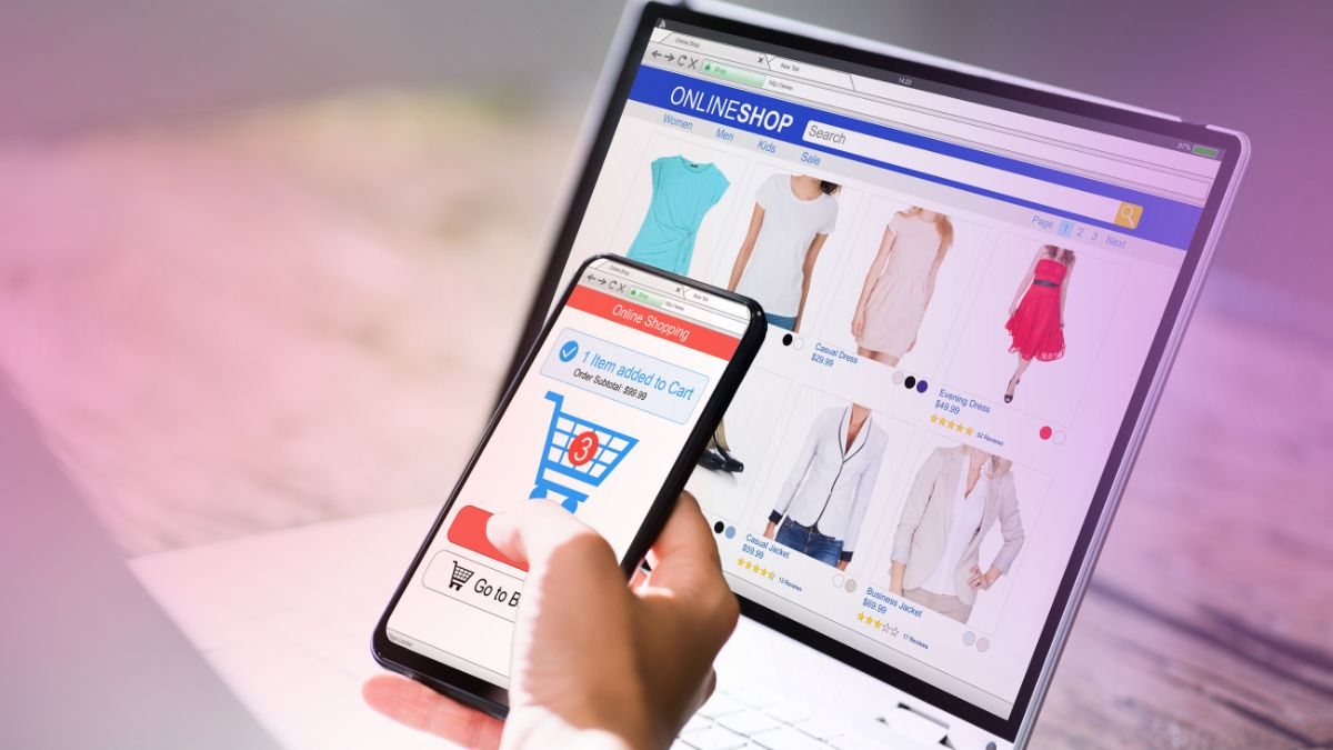 A shopper adding an item to a cart on a phone beside an online store on a laptop