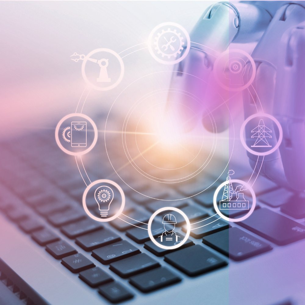 Linked system icons overlaid on a laptop keyboard, showing connected workflows